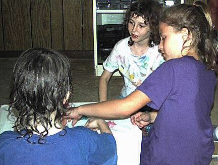 Kathryn, Andrea, and Vincent with big box and little frogs