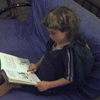 Vincent on couch with backpack on