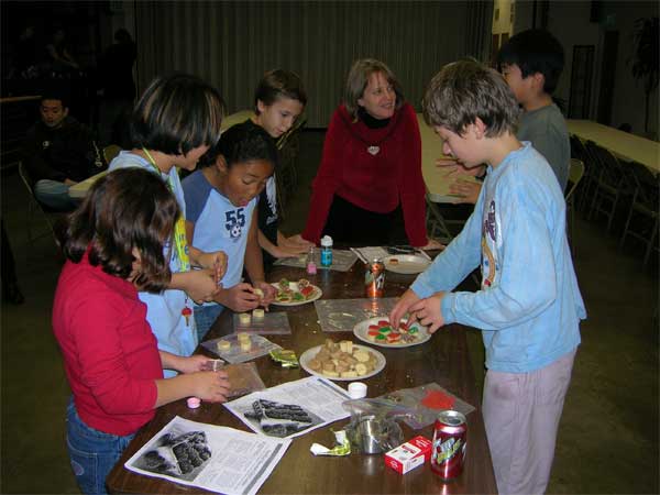 Kids making cookies.