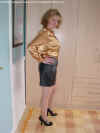 Anne in shinyblouse and leather mini skirt4