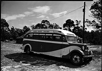 NAVA-HOPI TOUR BUS OPERATES BETWEEN GRCA S.RIM & FLAGSTAFF, AZ.  (BUS PARKED BY 2 THE HOGANS BETWEEN HOPI HOUSE AND VERKAMPS)<br>13 OCT 1938 NPS PHOTO.<br>