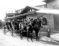 COACHING PARTY IN FRONT OF EL TOVAR HOTEL. WEARING WINTER COATS. BOARDING PLATFORM. SNOW ON GROUND. CIRCA 1905. FRED HARVEY