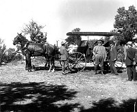 PRESIDENT WILLIAM HOWARD TAFT STANDS BY HORSE-DRAWN CARRAIGE ON S RIM OF GRAND CANYON. 15 OCT 1909. PHOTO: MOON, KARL (FHC)