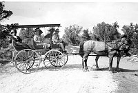 HORSE DRAWN COACH FROM RAILROAD TO BASS CAMP. OPEN CARRIAGE WITH 4 PASSENGERS.CIRCA 1910. LAUZON