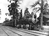 SANTA FE ENGINE 1251 W/ PASSENGER TRAIN BY GRCA DEPOT, TRAIN & STATION CREW POSE. CIRCA 1915. KOLB BROS.