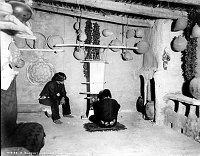 MALE HOPI WEAVES A WIDE SASH IN HOPI HOUSE &quotBLANKET WEAVER.&quot BASKETS HUNG ON WALLS. CIRCA 1905  DETROIT PHOTOGRAPHIC. GRCA 15803<br>