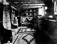 A SECOND FLOOR CORNER - RETAIL DISPLAY AREA IN THE HOPI HOUSE. BASKETS & CRAFTS. GRCA 49394 CIRCA 1905. DETROIT PUBLISHING.