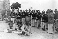HOPI CHANTERS. WOMEN GRINDING CORN. LOMAHAFTEWA FAMILY.WATCHTOWER DEDICATION. 13 MAY 1933. FRED HARVEY PHOTO.
