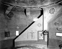 DESERT VIEW WATCHTOWER. INTERIOR HOPI ROOM. STAIRS TO FIRST GALLERY. DRUM DISPLAY. GRCA 15949. CIRCA 1932. FRED HARVEY CO. 