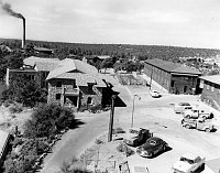 COLTER HALL, FRED HARVEY GIRLS & MARRIED COUPLES DORM FROM TOP BALCONY EL TOVAR. ALSO INDIAN DORM (R) AND BROWN BUILDING. (BEHIND) SMOKING POWERHOUSE BEYOND. 02 MAY 1956.  LEDING, NPS.
