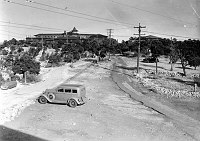 LOOKING TOWARDS EL TOVAR FROM THE 2ND FLOOR WINDOW FROM EAST END OF BROWN BUILDING. RIM PATH AND PARKING AREAS. 
