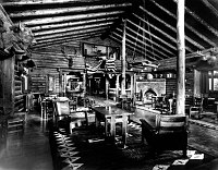 INTERIOR OF THE RENDEZVOUS ROOM, EL TOVAR HOTEL. AMERICAN FLAG DRAPED OVER MOOSE HEAD. GRCA 64886. 14 NOV 1906. PUTNAM AND VALENTINE.  