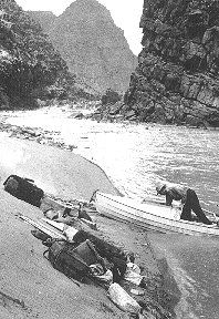 GCNP IMAGE 17151  Boat in Ladore Canyon. Provisions and supplies spread on beach to dry.