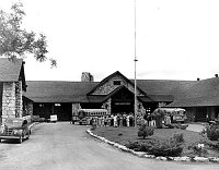 OVERVIEW OF THE &quotSING-AWAY&quot CEREMONY AS VISITORS LEAVE GRAND CANYON LODGE ON THE NORTH RIM. 2 BUSSES. 23 JUNE 1949<br>