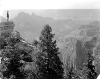 THOMAS MCKEE,  MANAGER, WYLIE WAY CAMP, STANDING AT BRIGHT ANGEL POINT ON THE NORTH RIM AND ABOVE BRIGHT ANGEL CREEK. GRCA 62441. CIRCA 1919. BEAM, DENVER AND RIO GRANDE WESTERN RR CO.