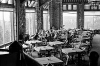 VIEW OF NORTH RIM GRAND CANYON LODGE DINING ROOM TOWARDS PICTURE WINDOWS. CIRCA 1980. NPS PHOTO.<br>