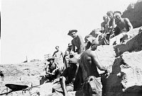 CCC WORK AT RAMPART CAVE: SPIKE CREW POSE AT WILLOW BEACH. SITTING ON ROCKS. PHOTO BY MICHAEL BOBKO