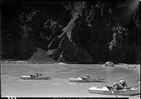 FIRST NEVILLS COLORADO RIVER EXPEDITION. 3 BOATS, 5 PEOPLE ON THE RIVER PULLING INTO A BEACH BY PHANTOM RANCH. 22 JUL 1938 NPS PHOTO