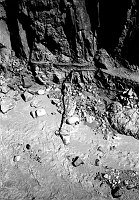 ABOVE PHANTOM RANCH. TRANS-CANYON WATER PIPELINE BROKEN AT A 90 DEGREE ANGLE DURING FLASH FLOOD. WASHED OUT SECTION OF N KAIBAB TRAIL IN THE BOX. MAR 1995 NPS PHOTO