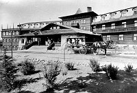 2 HORSE CARRAIGE TO RIGHT OF FRONT ENTRANCE, EL TOVAR HOTEL. FAMILY ON PORCH. CIRCA 1908. GRAND CANYON N.P. MUSEUM COLLECTION 