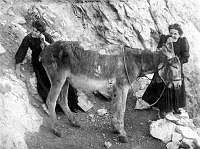HUMOROUS POSE OF 2 HARVEY GIRLS USING A &quotDONKEY TELEPHONE.&quot (PER EMERY KOLB) GRCA 30590. CIRCA 1906. KOLB BROS.