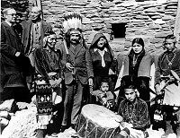 DR & MRS ALBERT EINSTEIN POSE WITH FRED HARVEY'S HOPI EMPLOYEES BY HOPI HOUSE. HERMAN SCHWEIZER OF THE FRED HARVEY INDIAN DEPARTMENT IS SECOND FROM THE LEFT. FEBRUARY 1931. FRED HARVEY PHOTO.