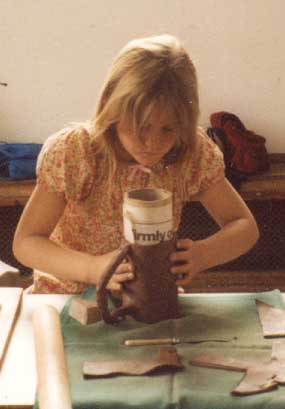 Girl making a pot