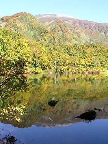 Chokai reflected in a lake on beautiful day.
