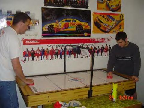 Nick E. and Mike M. battle it out for an air hockey win