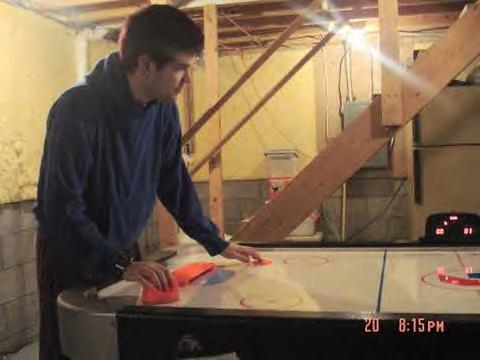 Andy Frank playing air hockey