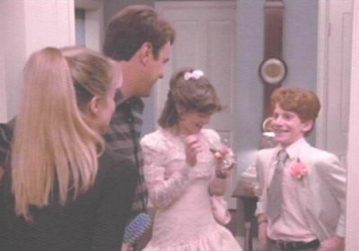 "Heh Heh, she likes my little-boy cuteness.&nbsp; Just wait till I'm a towering 6ft, then she'll really like me."