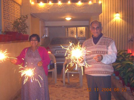 my parents celebrating Diwali at our house