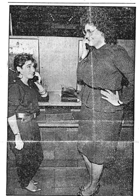 height compare between tiny woman and tall woman