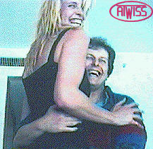 Short man hugging Giantess
