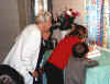 Kit and her little helpers blow out the birthday candles