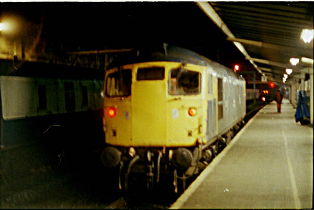 26023