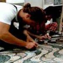 Fitting a tessera into the work of art