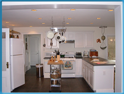 View of kitchen stove and island