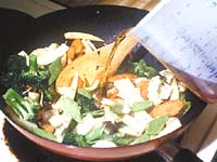 Continue stir-frying until about half cooked