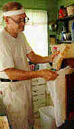 Photo of me putting the honeycomb into a pressing bag
