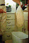 Photo of the pressed wax andsticky bag being washed off in a water tub