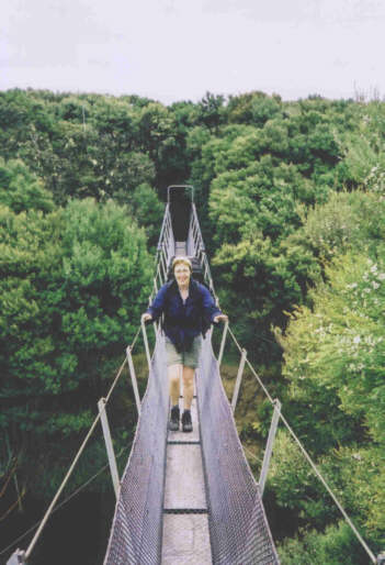 Angela on a suspension bridge, Freshwater, Stewart Island