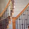 A curving wood and metal staircase