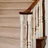 Darker wood and painted wood create this stunning curved staircase