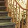 A natural wood curved staircase