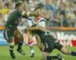 click 2 enlarge ....... Warriors Kevin Campion hits Minichello low as Lauititi comes in over the top