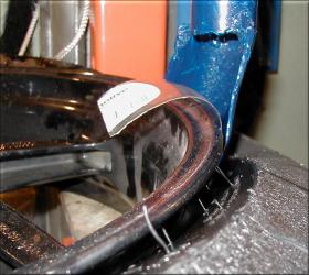 Using the bead breaker spoon on the press