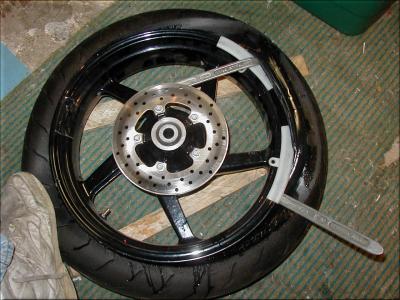 Push the tire into the drop center and pry opposite