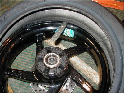 Push the tire into the drop center and pry opposite
