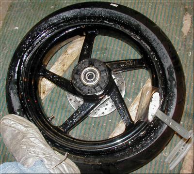 Push the tire most of the way by hand